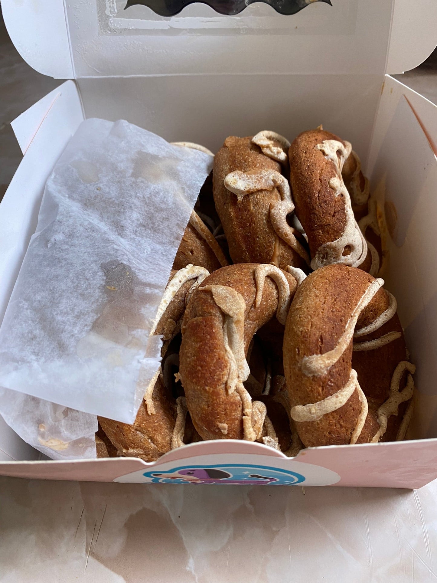 Box of cookies with cream filling on a white background