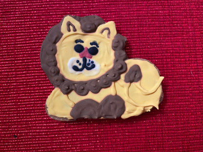 Lion-shaped cookie on a red background