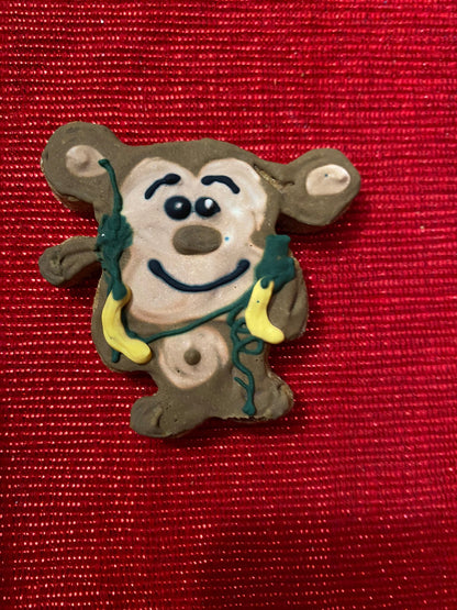 Mouse-shaped ornament with a red background