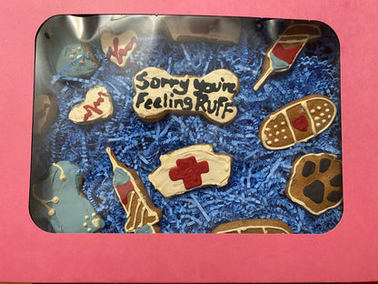 Cookie assortment with 'Sorry You're Feeling RUFF' message on a pink background