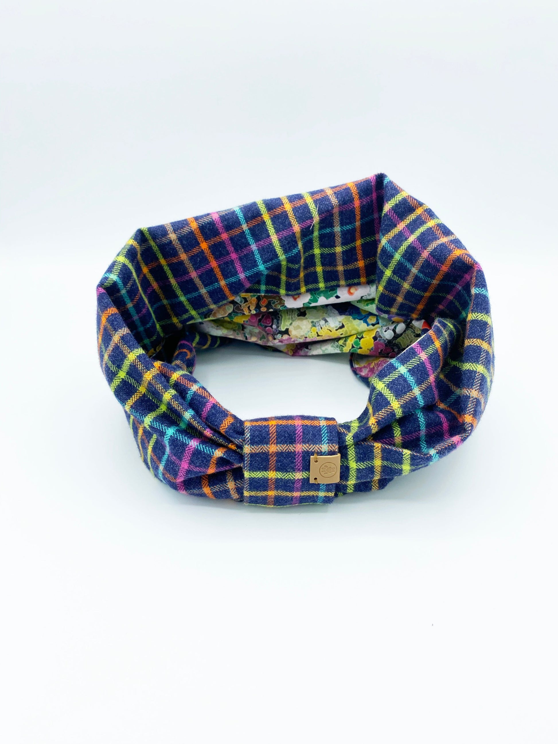 Plaid patterned headband on a white background