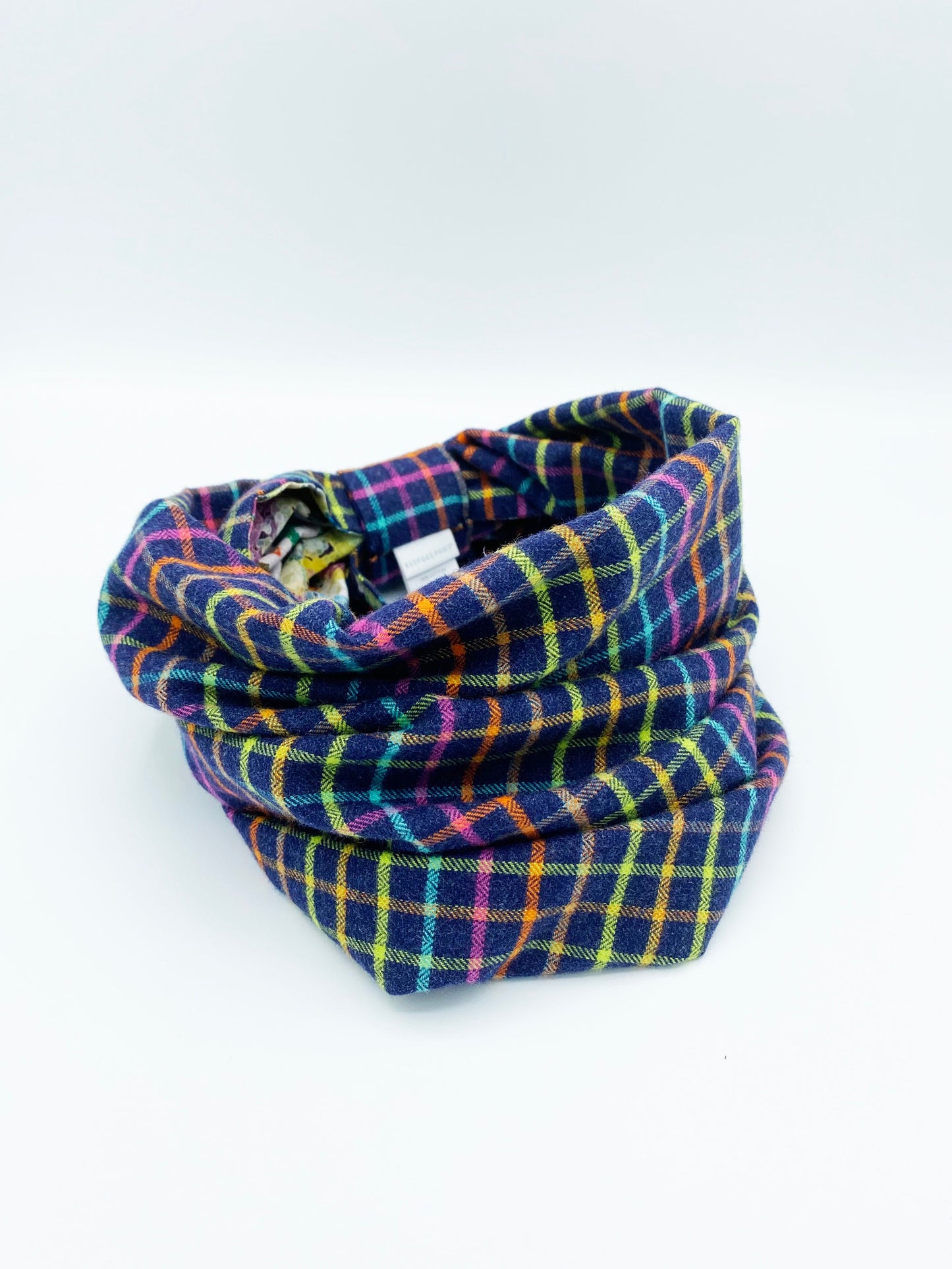 Plaid patterned neckwarmer on a white background