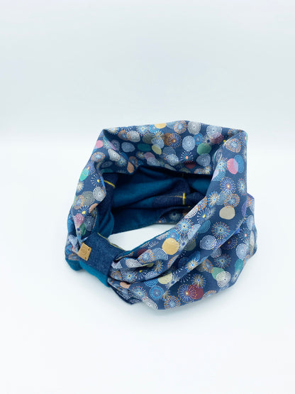 Blue patterned fabric tube on a white background
