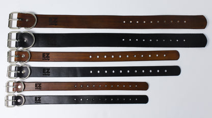 Set of leather belts in various colors on a white background