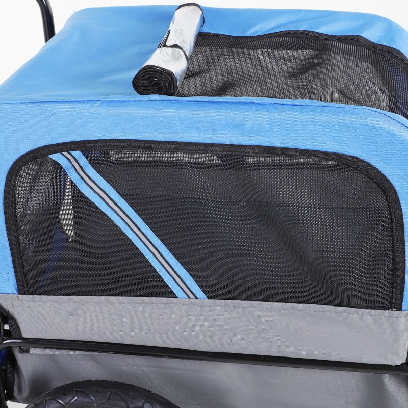 Blue and black pet stroller with a rolled-up mat on top