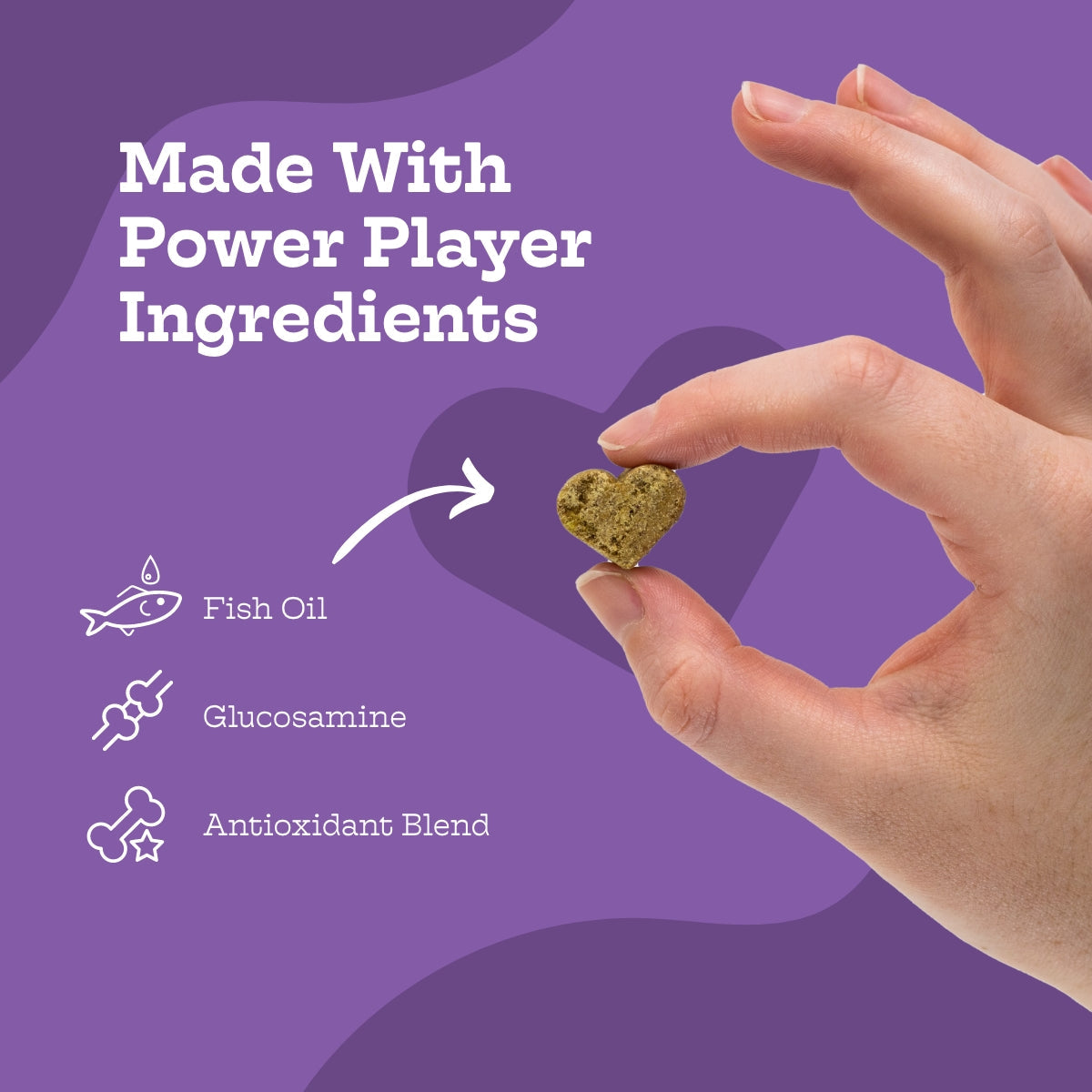 Hand holding a heart-shaped supplement with 'Made With Power Player Ingredients' text and icons on a purple background.