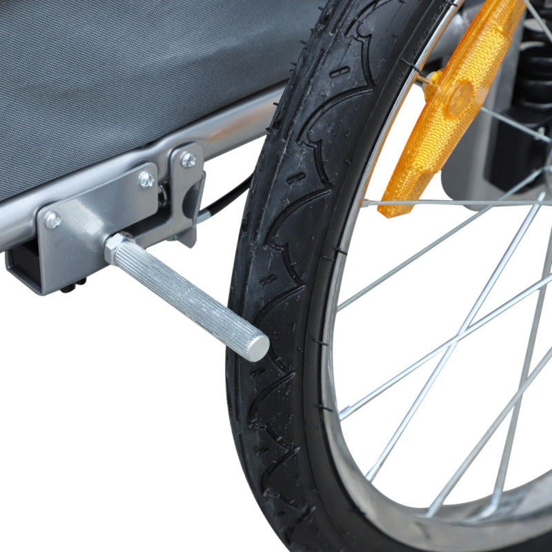 Close-up of a bicycle wheel with a trailer attachment on a white background