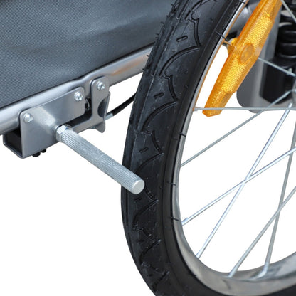 Close-up of a bicycle wheel with a trailer attachment on a white background