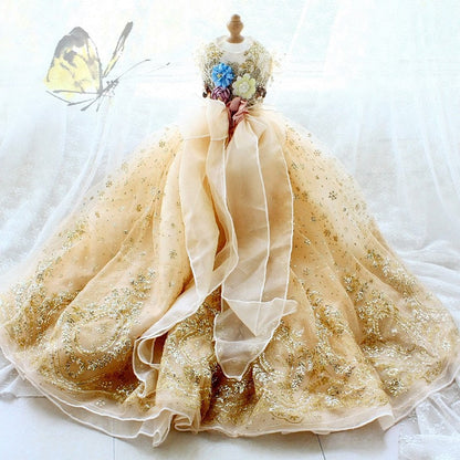 Beige princess-style dress on a mannequin with flowers, on a white background