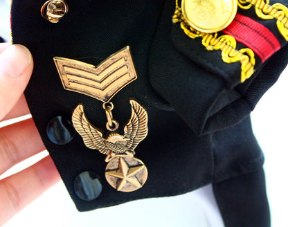 Close-up of a military uniform with insignia and decorations.