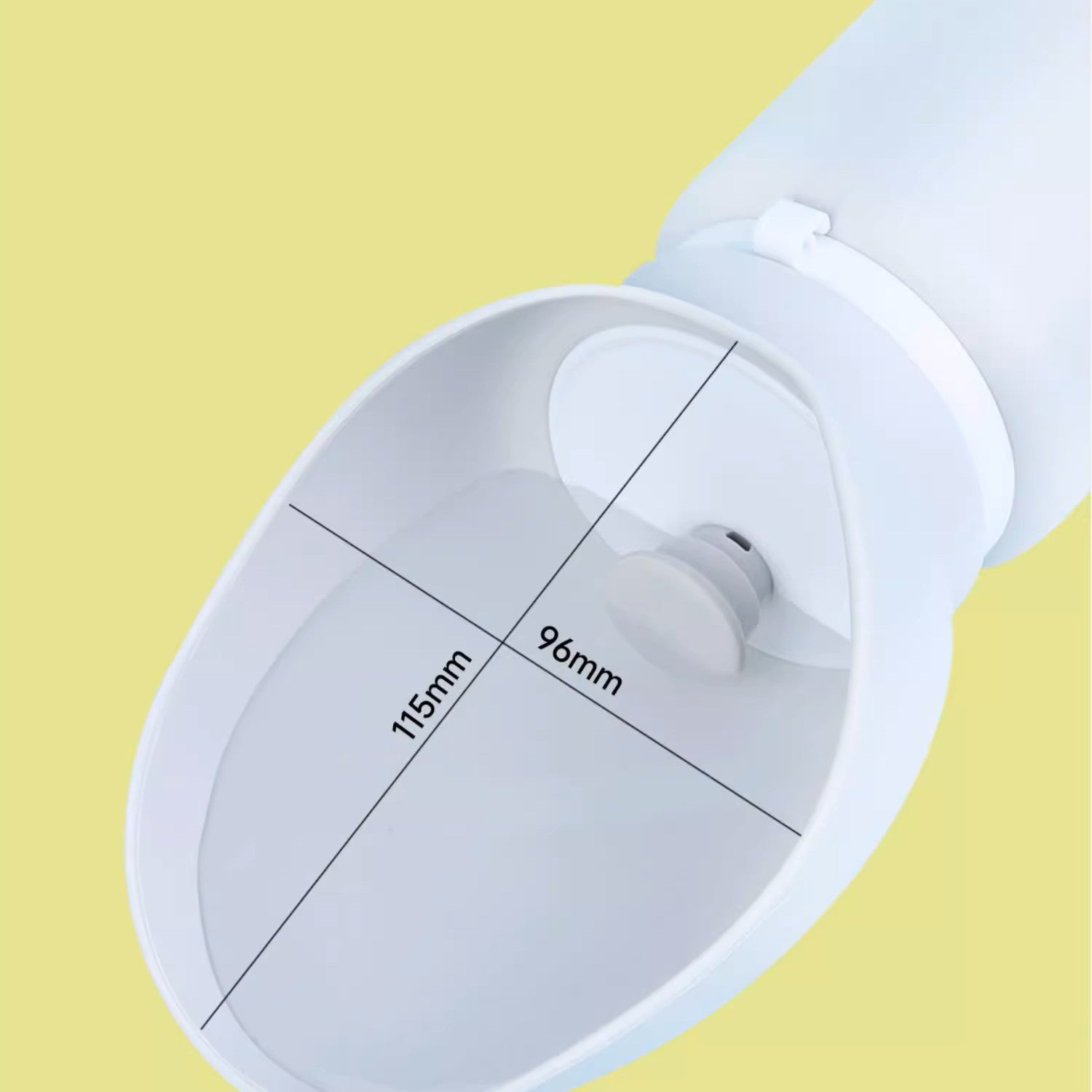 White measuring cup with measurements on a yellow background