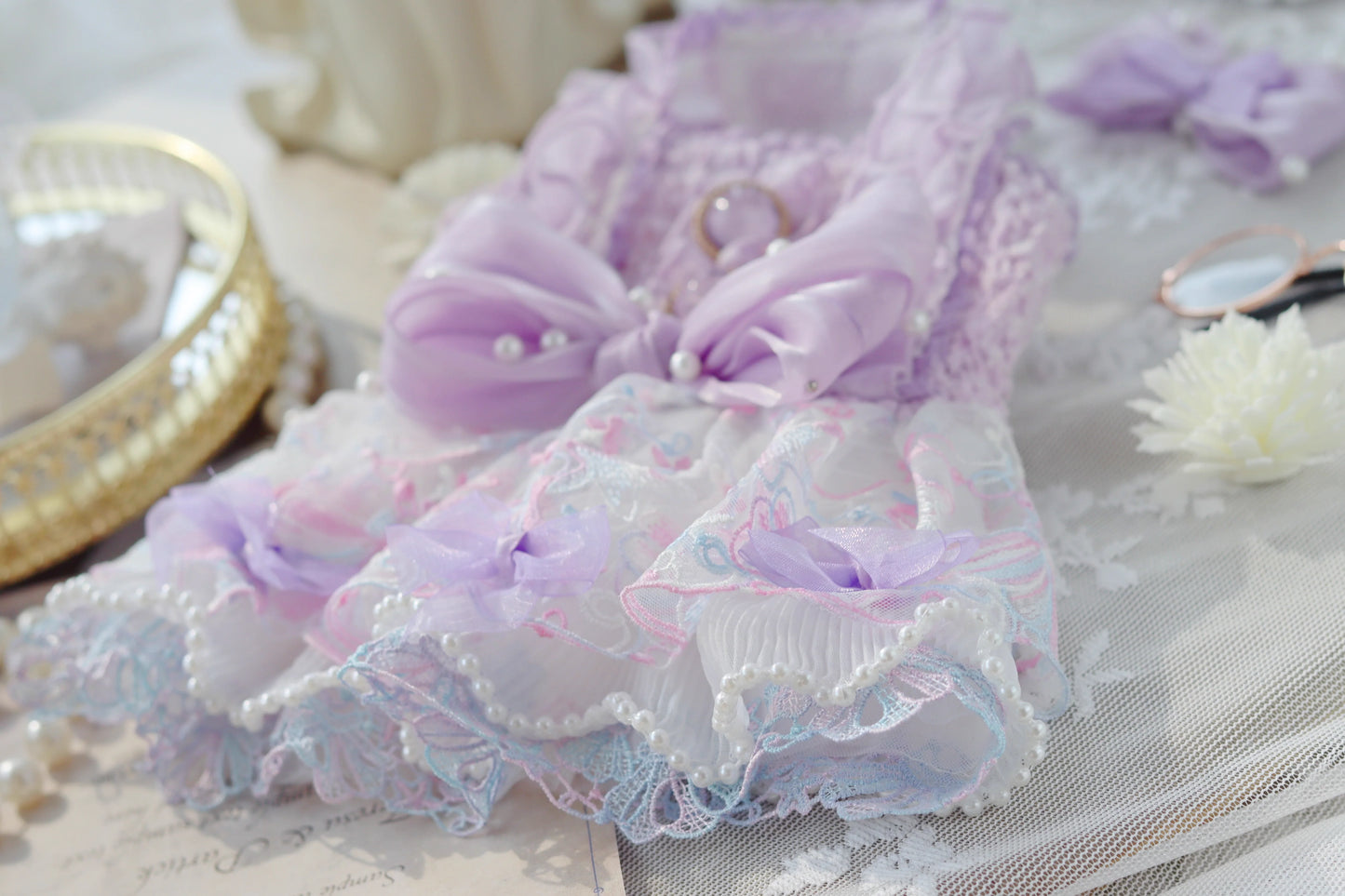 Delicate lace fabric with floral patterns and pearls on a soft background