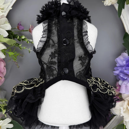 Black lace dress on a mannequin with floral decorations