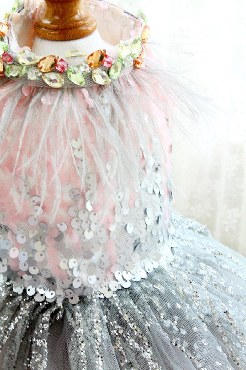Children's dress with pink sequin top and gray skirt on a mannequin.