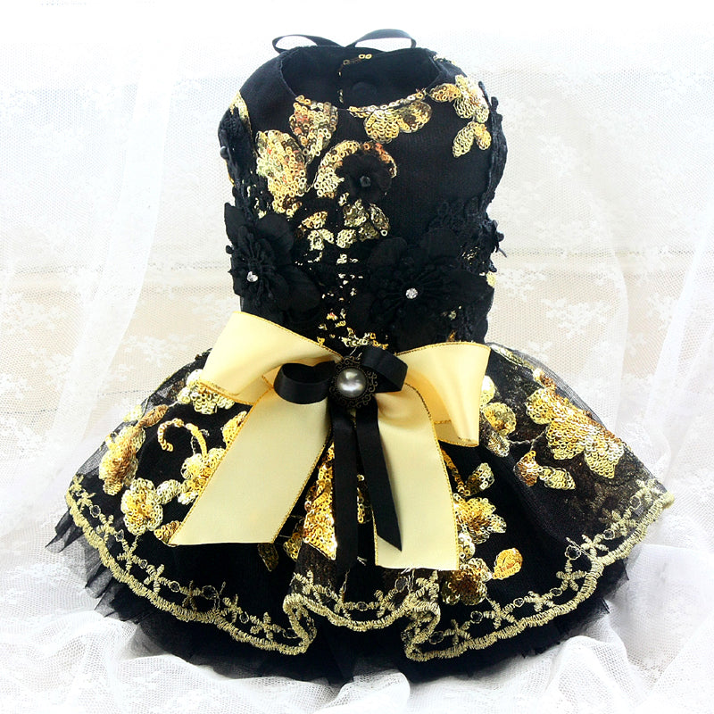 Black and gold decorative dress on a white background