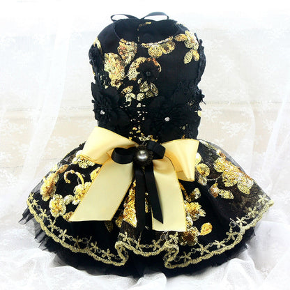 Black and gold decorative dress on a white background