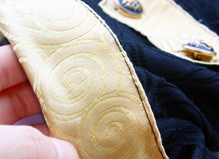 Close-up of a textured beige strap with a navy fabric background