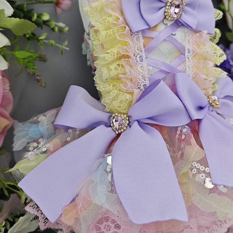 Decorative headband with purple bows and floral elements on a blurred floral background