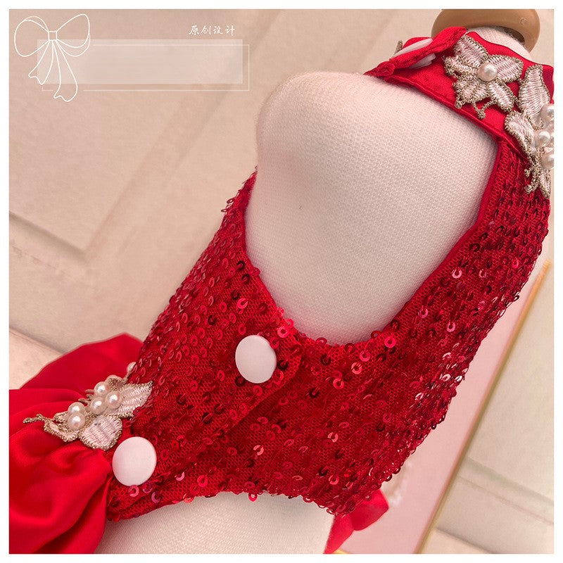 Red sequined headband with decorative elements on a mannequin head.