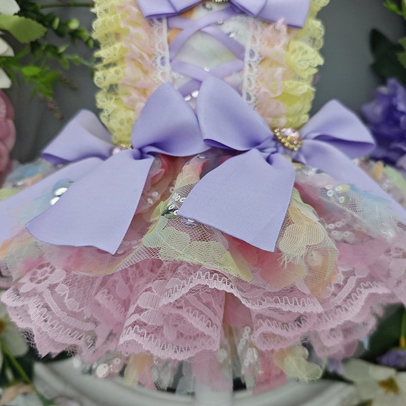 Decorative item with pastel colors and lace details, featuring a prominent bow.