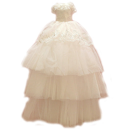 Beige lace dress with multiple layers on a white background