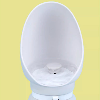 White urinal against a yellow background