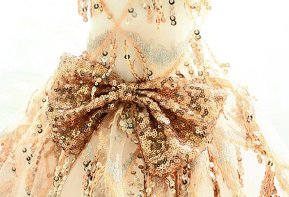 Decorative item with a large bow and sequin details on a white background