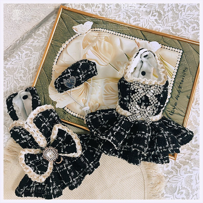 Black and white decorative hair accessories on a textured surface