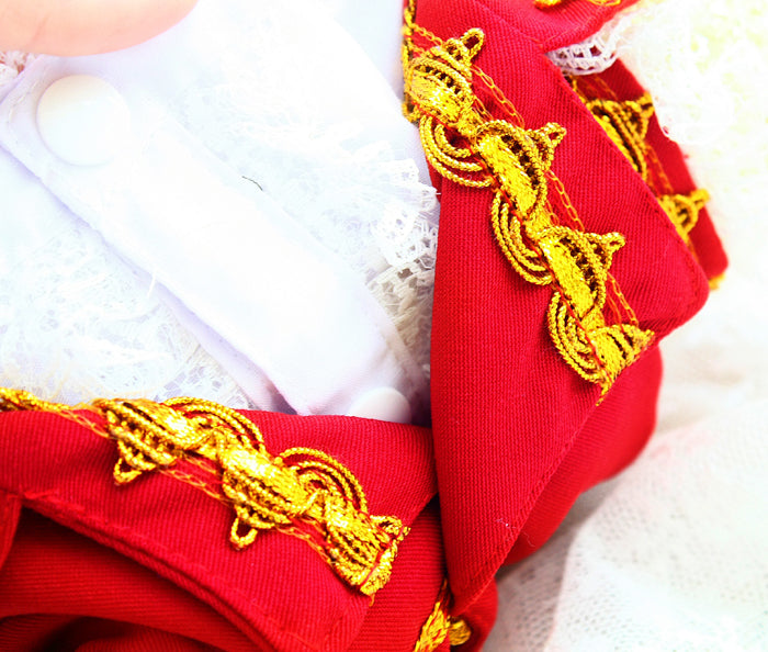 Red garment with gold embroidery on a white background