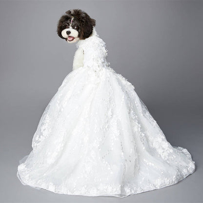 Dog wearing a white wedding dress on a gray background