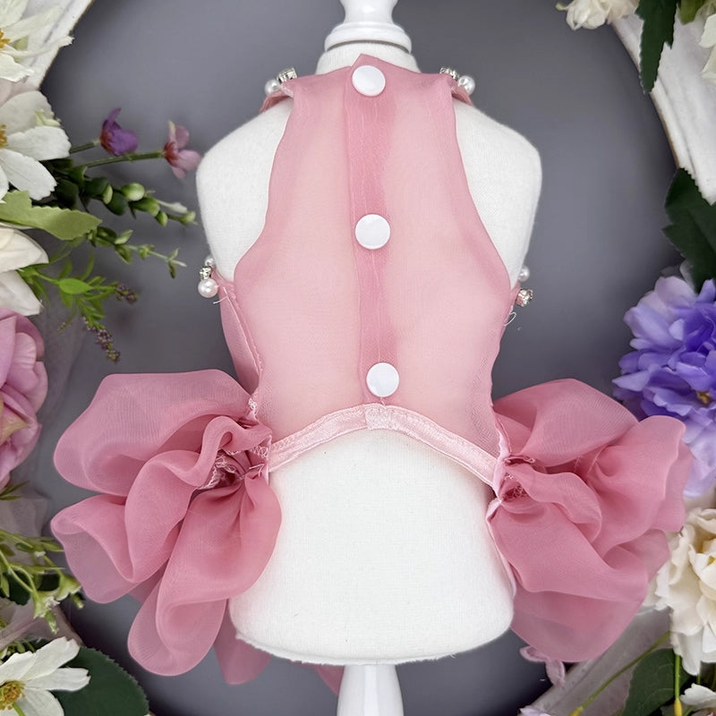 Pink pet dress on a mannequin with floral decorations
