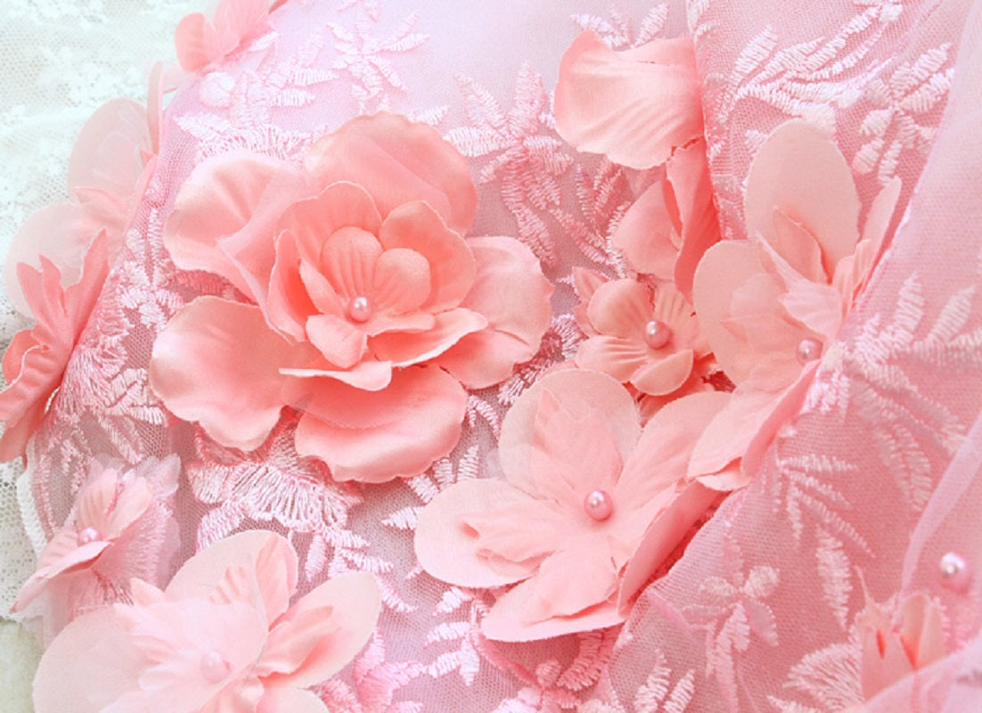 Pink floral decorations on a textured white background