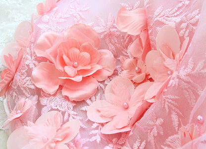 Pink floral decorations on a textured white background