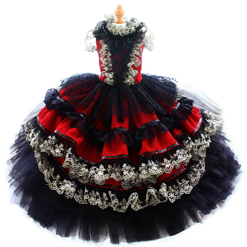 Red and black dress with intricate detailing on a white background