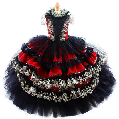 Red and black dress with intricate detailing on a white background