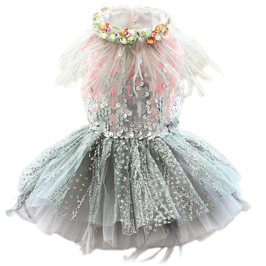 Children's dress with sequins and a floral headband on a white background