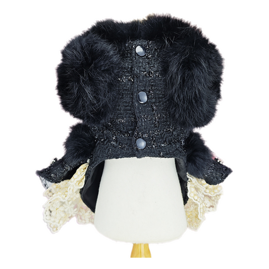 Black textured jacket with fur trim on a mannequin against a white background