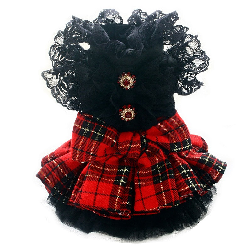 Dog dress with red plaid pattern and black lace details on a white background