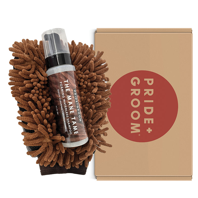 Pride & Groom grooming product set with a bottle and scrubber on a white background