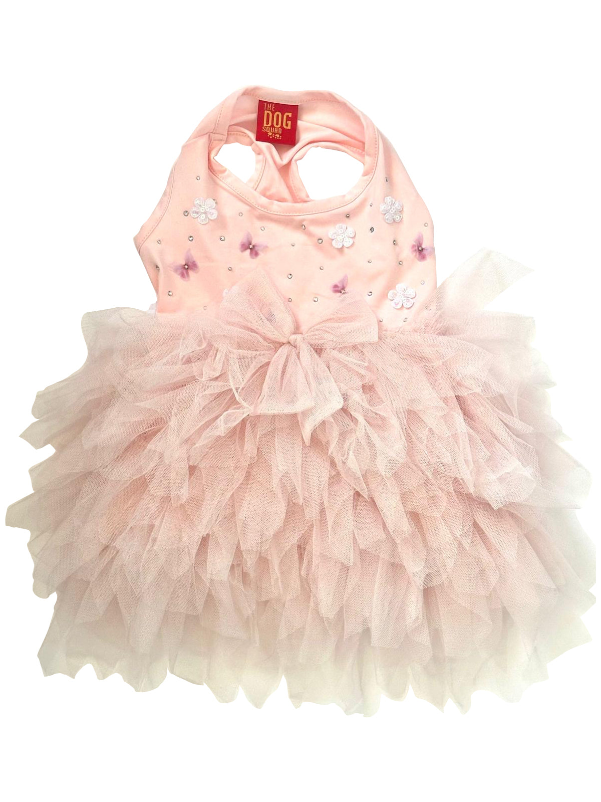 Pink pet dress with ruffles and a bow on a white background