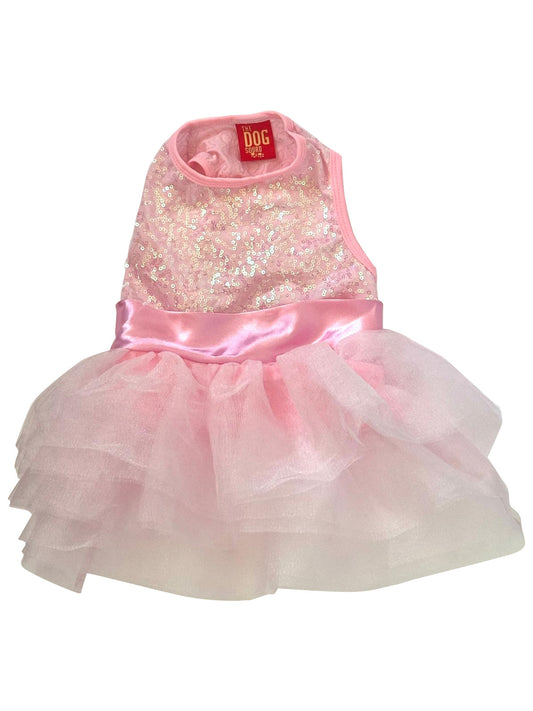 Pink sequin dress with a tutu skirt on a white background