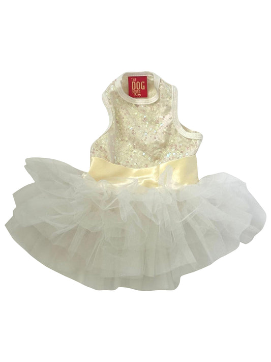 Dog dress with gold sequin top and white tulle skirt on a white background