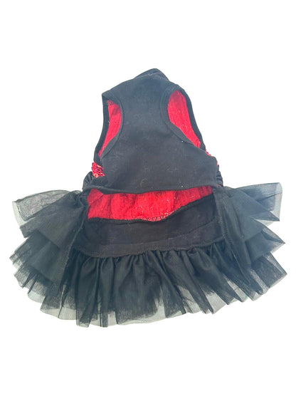 Black pet dress with red interior and sheer black skirt on a white background