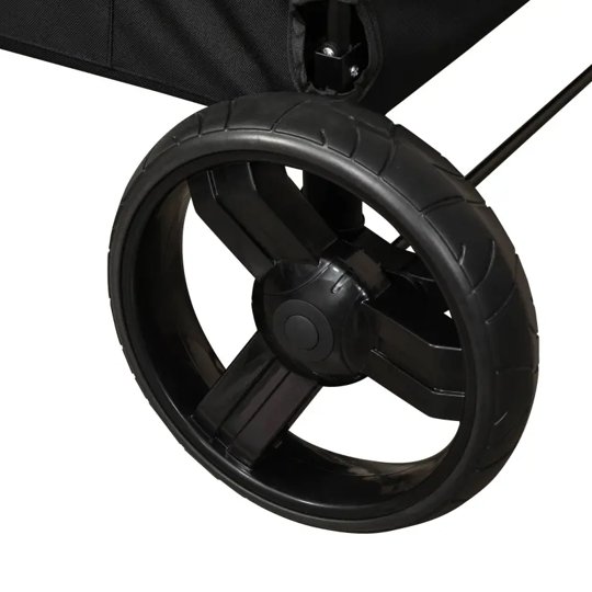 Close-up of a black stroller wheel on a white background