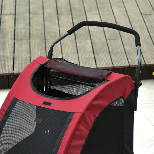 Red and black pet stroller on a wooden floor