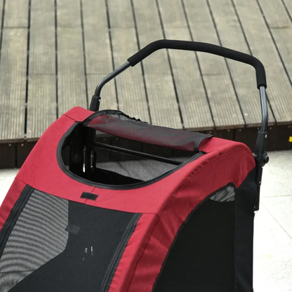 Red and black pet stroller on a wooden floor
