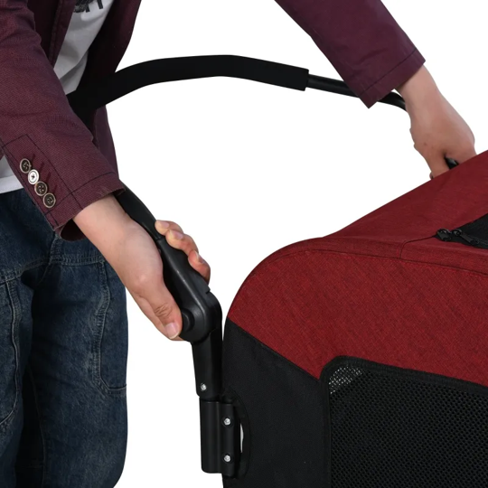 Person holding a red and black stroller handle on a white background