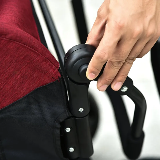 Hand adjusting a black umbrella handle on a white background