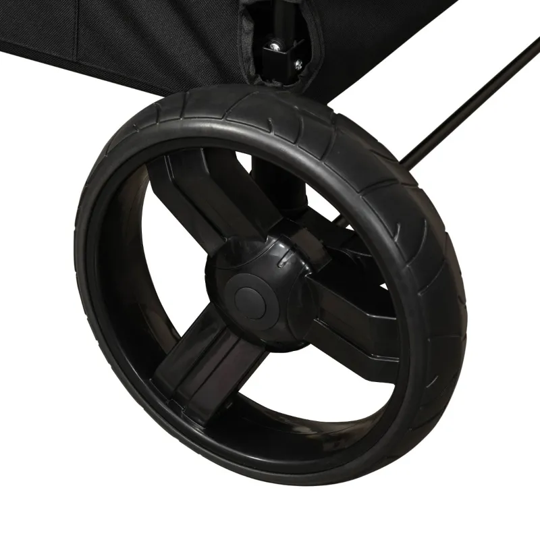 Close-up of a black stroller wheel on a white background