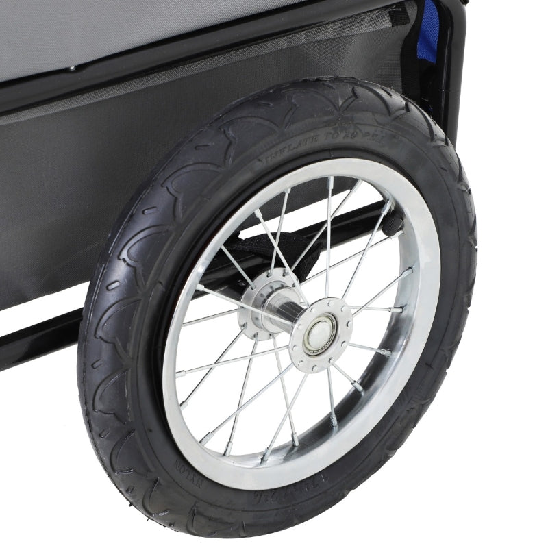 Close-up of a black tire with a white rim on a vehicle.